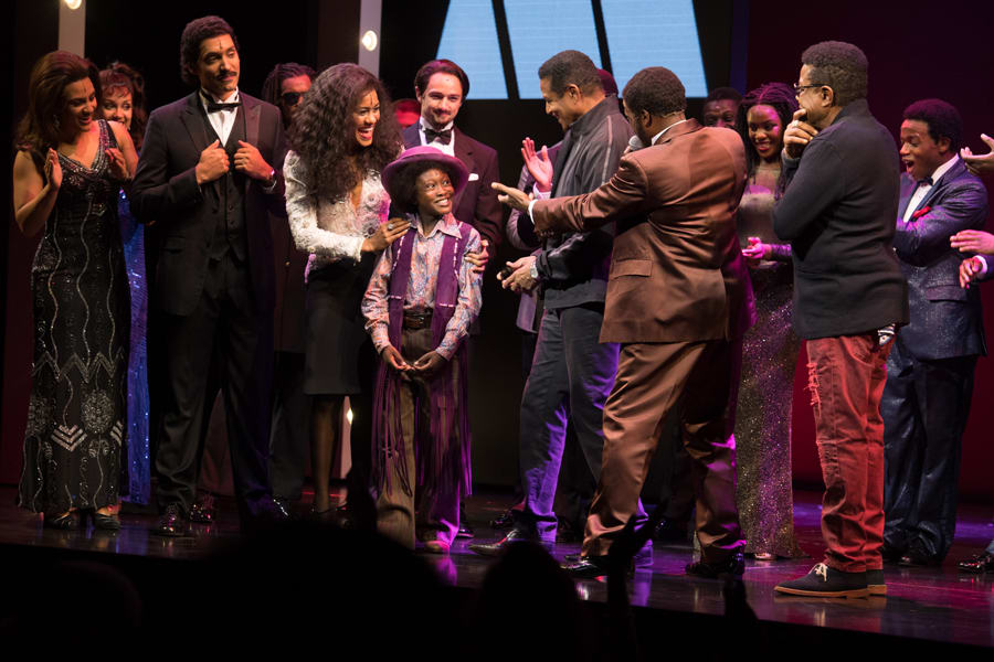 Raphael Higgins-Humes (Young Michael Jackson) and the cast of Motown The Musical with Jackie Jackson and Tito Jackson (Photo: Craig Sugden)