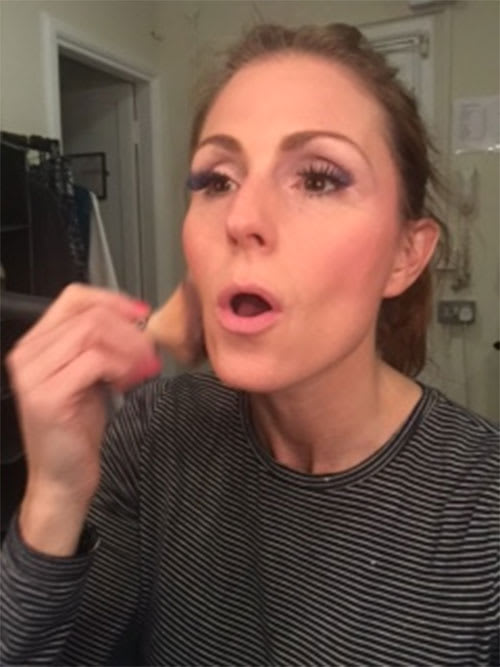 Rebecca Thornhill putting her make-up on