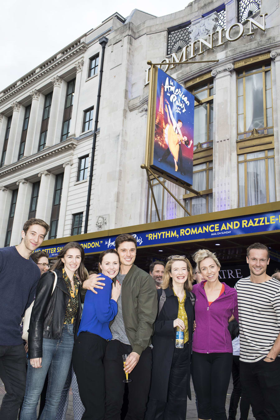 The cast of An American In Paris outside the Dominion Theatre