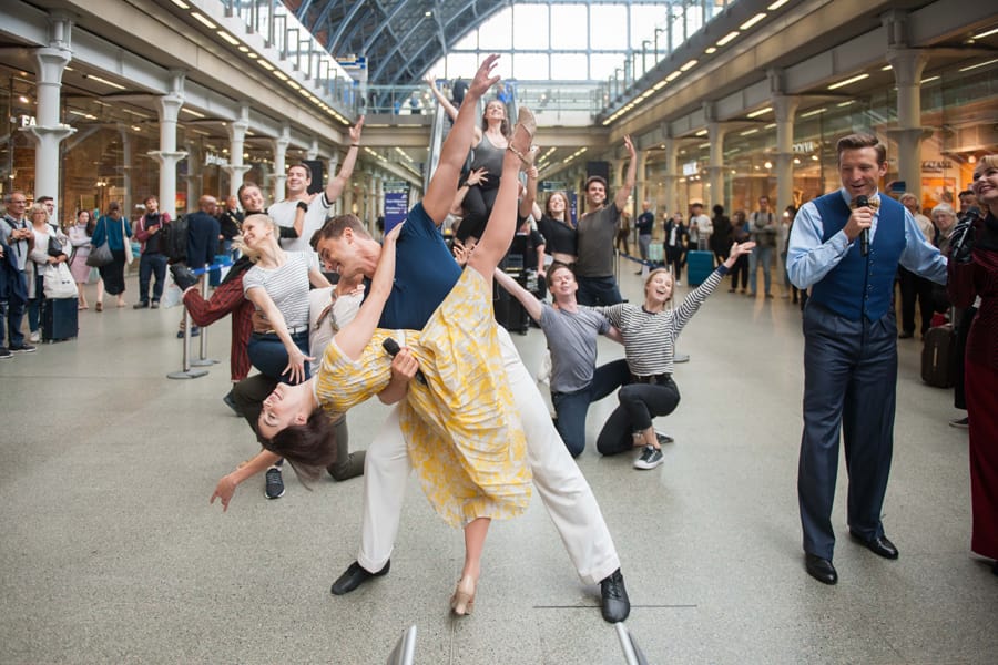 The cast of An American In Paris at St Pancras International station